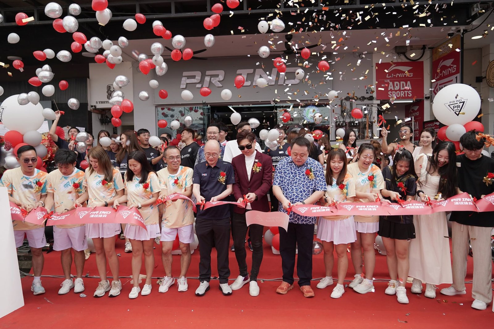 Ribbon-cutting ceremony at the PRIND store opening, with confetti and balloons